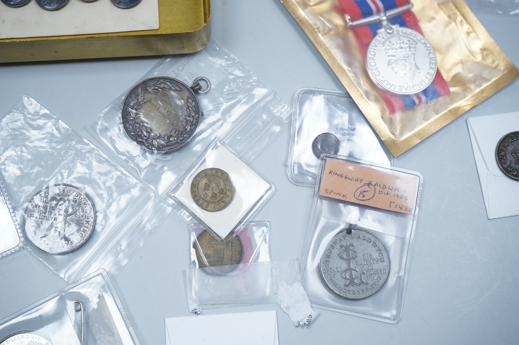 A QSA medal group miniature, comprising miniatures of; the Queen Victoria Golden Jubilee medal, the Queen’s South Africa medal with three clasps, the King’s South Africa medal with two clasps and the Africa General Servi